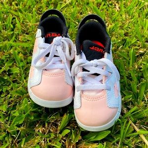 Jordan Baby 6C pink/white color shoes. Fits a 2 year old. Hardly used.